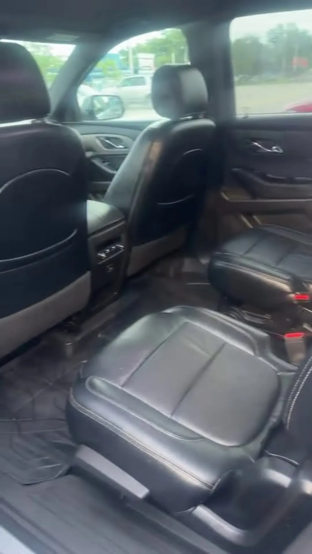 After: the same SUV cabin cleaned, leather seats wiped down