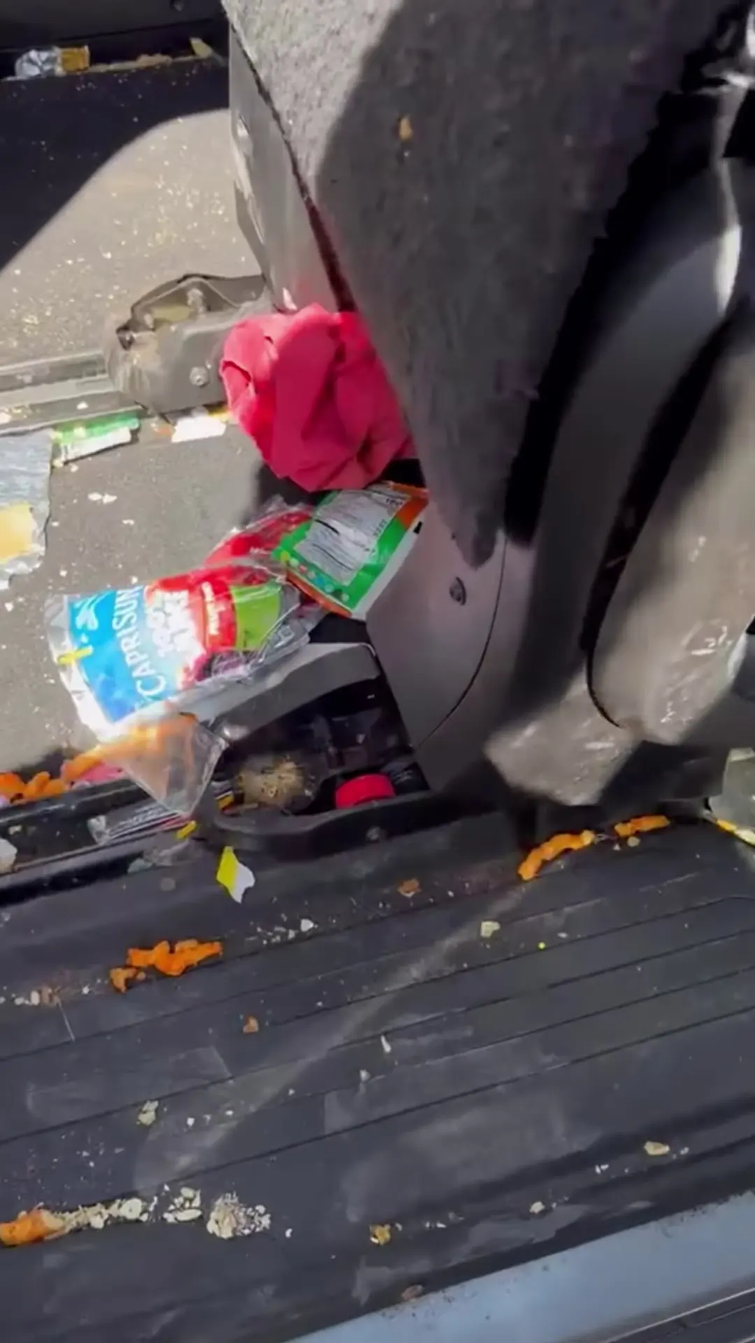 Before: trash and spilled snacks behind the seats