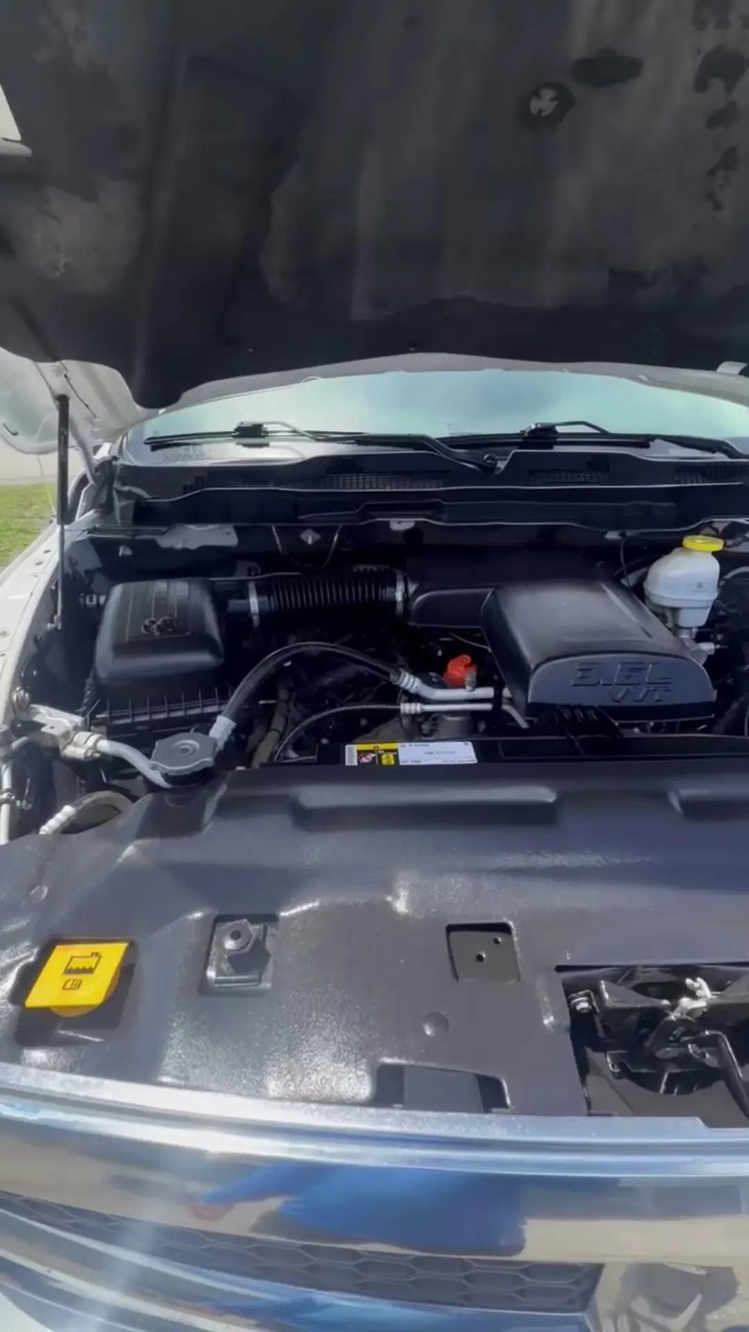 Clean engine bay of a pickup truck with the hood open