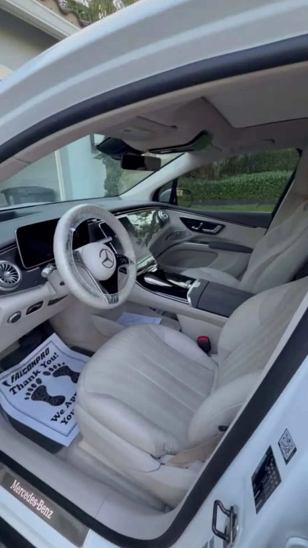Clean cream leather interior of a Mercedes EQ after a detail